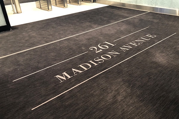 Custom lobby entrance mat at an office building